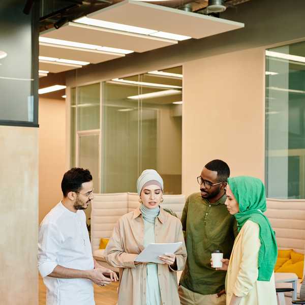 Colleagues reviewing documents together in an office